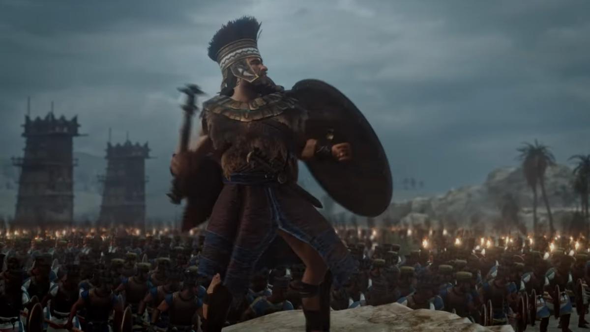 Total War: Pharaoh screenshot showing a man giving his army the signal to attack.